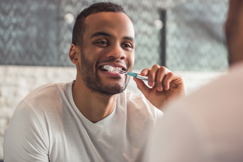 dental-patient-brushing-teeth dental patient brushing teeth