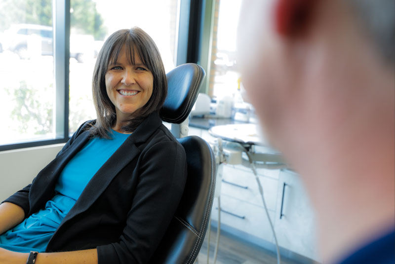 lisa_olson_smile_interaction_crowns smiling dental patient