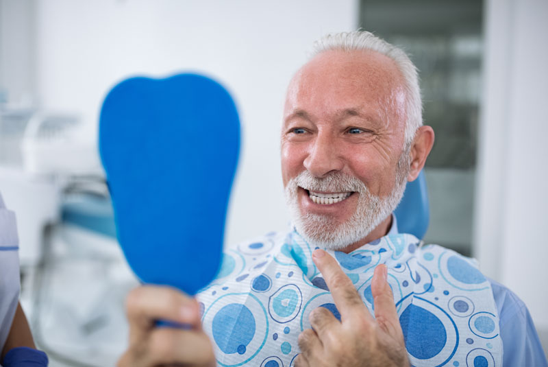 My Dental Company - Dental patient smiling after successful dental implant surgery without anxiety