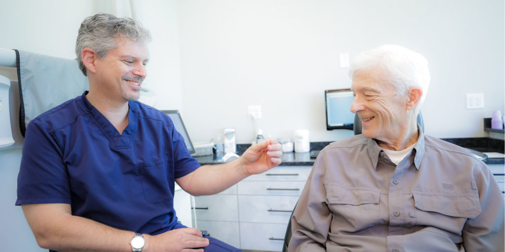 olson_chuck_restoration_implant-1024x512 Dr Olson talking to a patient about implants